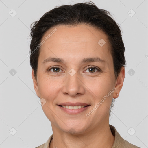 Joyful white adult female with short  brown hair and brown eyes