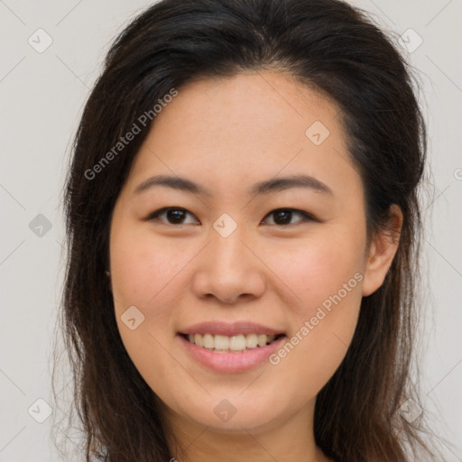 Joyful asian young-adult female with long  brown hair and brown eyes