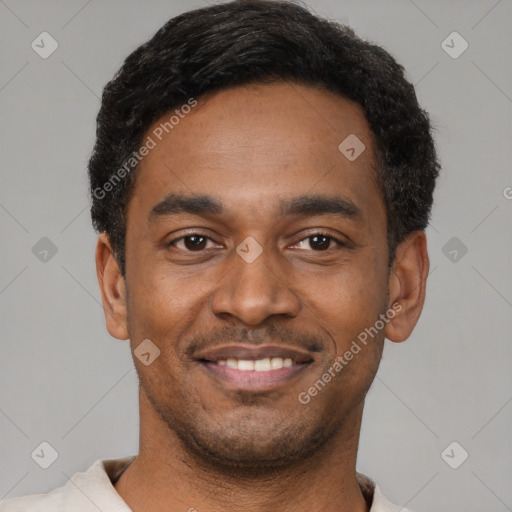 Joyful latino young-adult male with short  black hair and brown eyes