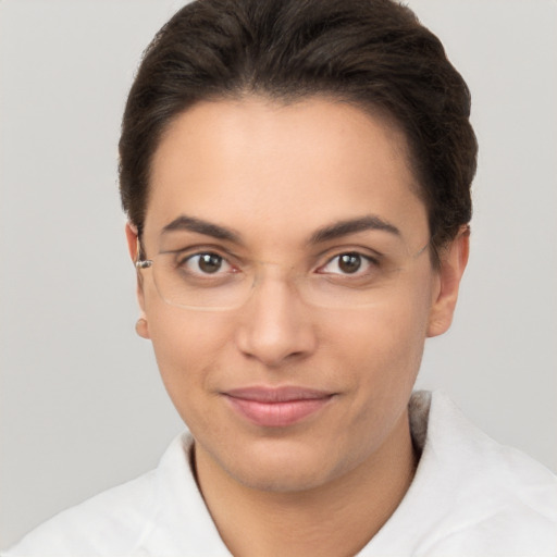 Joyful white young-adult female with short  brown hair and brown eyes