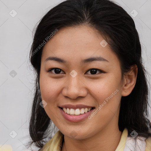 Joyful asian young-adult female with medium  brown hair and brown eyes