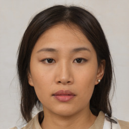 Neutral asian young-adult female with medium  brown hair and brown eyes