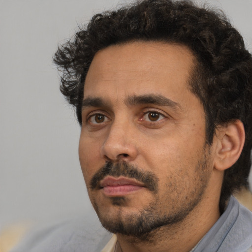 Neutral white adult male with short  black hair and brown eyes
