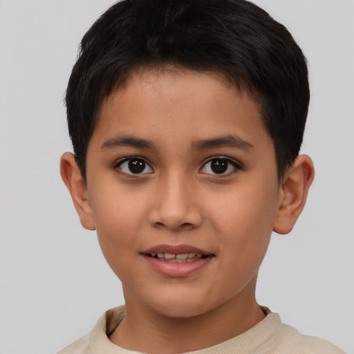 Joyful asian child male with short  brown hair and brown eyes