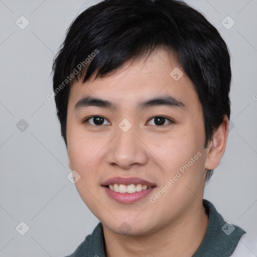 Joyful asian young-adult male with short  black hair and brown eyes