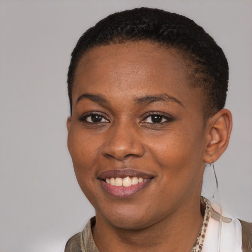 Joyful black young-adult female with short  brown hair and brown eyes