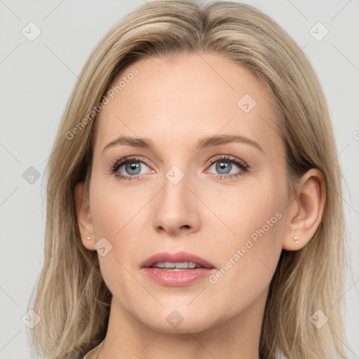 Joyful white young-adult female with long  brown hair and blue eyes