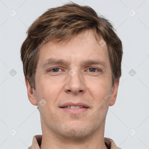 Joyful white adult male with short  brown hair and grey eyes