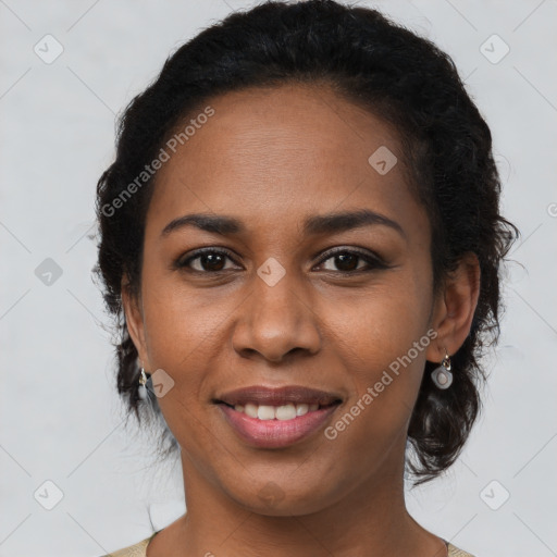 Joyful black young-adult female with medium  brown hair and brown eyes