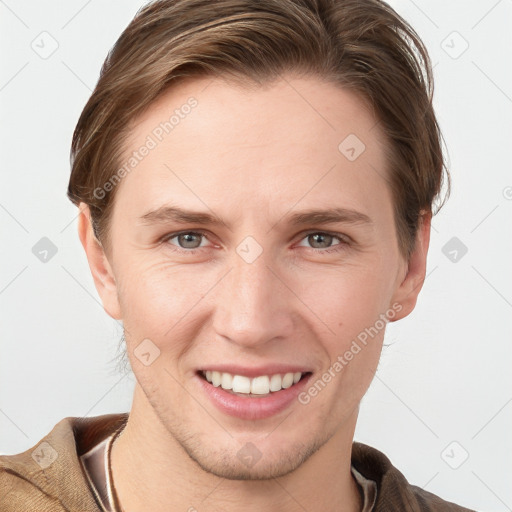 Joyful white young-adult female with short  brown hair and grey eyes