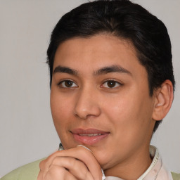 Joyful latino young-adult male with short  brown hair and brown eyes