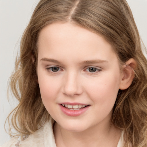 Joyful white child female with long  brown hair and grey eyes