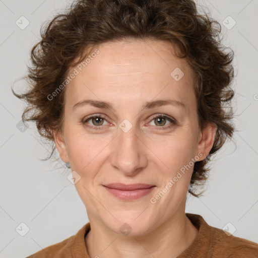 Joyful white adult female with medium  brown hair and green eyes