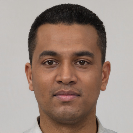 Neutral latino young-adult male with short  black hair and brown eyes