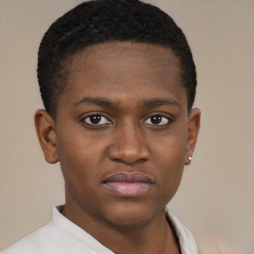Joyful black young-adult male with short  brown hair and brown eyes