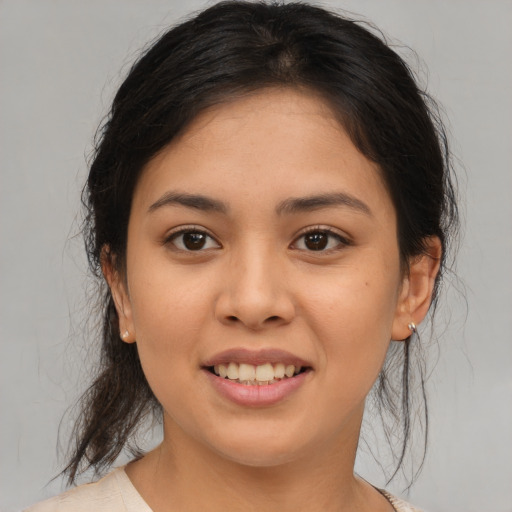 Joyful asian young-adult female with medium  brown hair and brown eyes