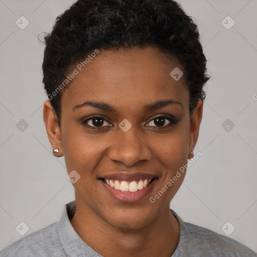 Joyful black young-adult female with short  black hair and brown eyes