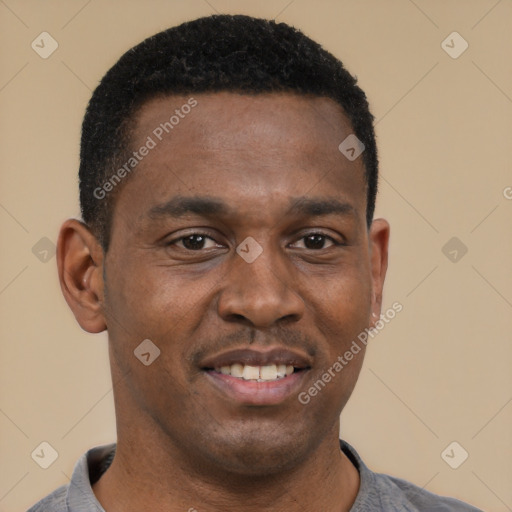 Joyful black young-adult male with short  black hair and brown eyes