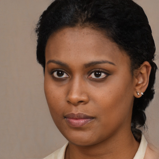 Neutral black young-adult female with medium  black hair and brown eyes