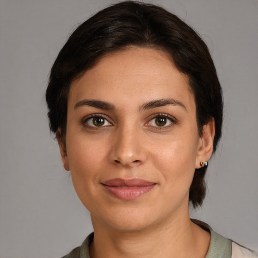 Joyful white young-adult female with medium  brown hair and brown eyes