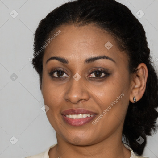 Joyful black young-adult female with medium  brown hair and brown eyes