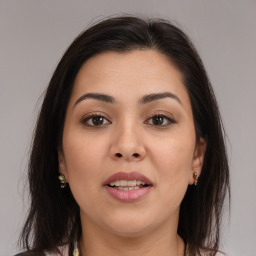 Joyful white young-adult female with medium  brown hair and brown eyes