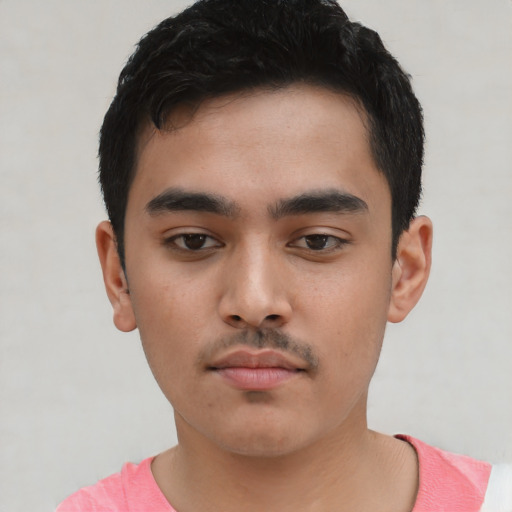 Neutral white young-adult male with short  black hair and brown eyes