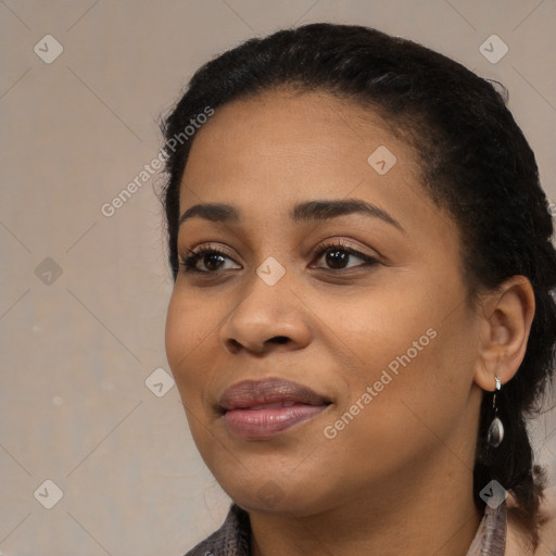 Joyful black young-adult female with medium  black hair and brown eyes