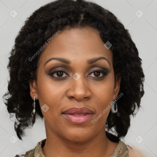 Joyful black young-adult female with medium  brown hair and brown eyes