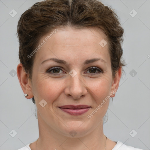 Joyful white adult female with short  brown hair and brown eyes