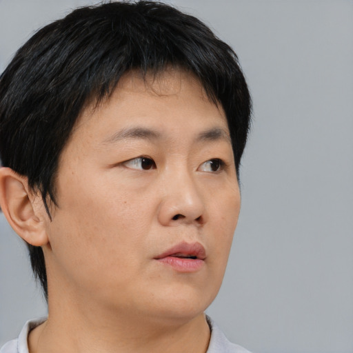 Neutral asian young-adult male with short  black hair and brown eyes