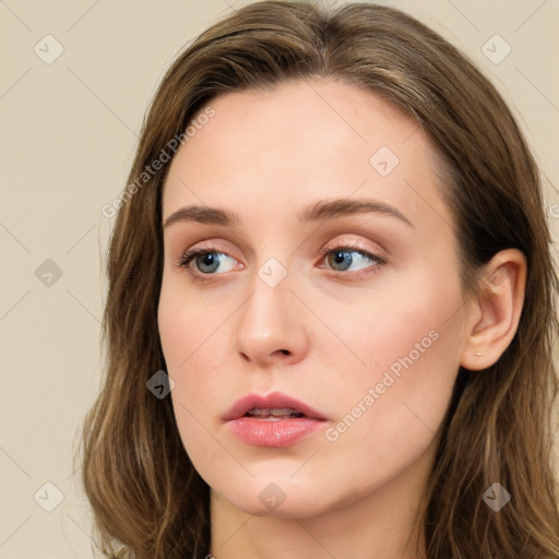 Neutral white young-adult female with long  brown hair and green eyes