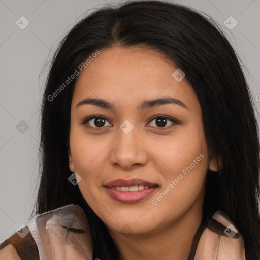 Joyful latino young-adult female with long  brown hair and brown eyes