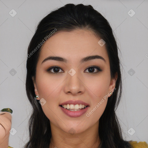 Joyful asian young-adult female with long  brown hair and brown eyes