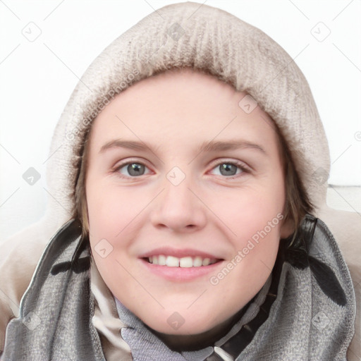 Joyful white young-adult female with long  brown hair and blue eyes