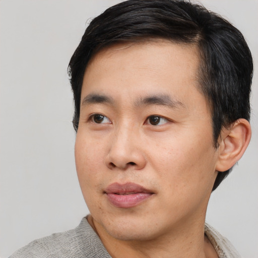 Neutral asian young-adult male with short  black hair and brown eyes