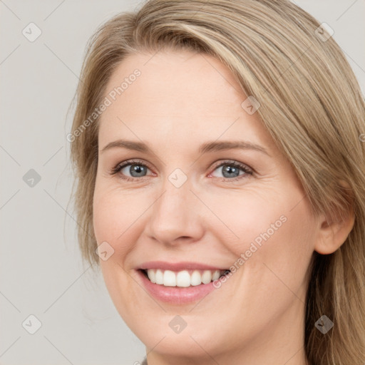 Joyful white young-adult female with long  brown hair and green eyes