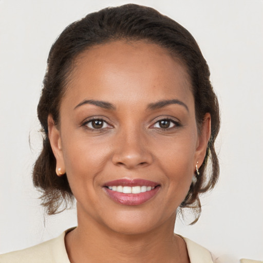 Joyful white young-adult female with medium  brown hair and brown eyes