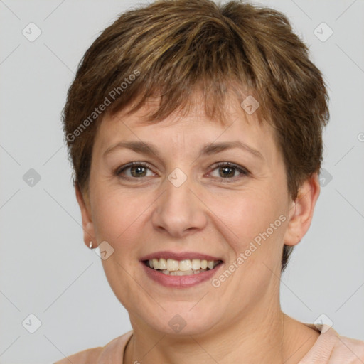 Joyful white adult female with short  brown hair and brown eyes