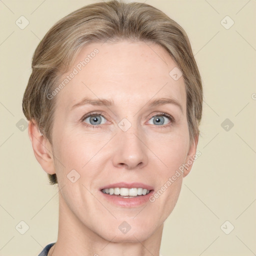 Joyful white adult female with short  brown hair and grey eyes