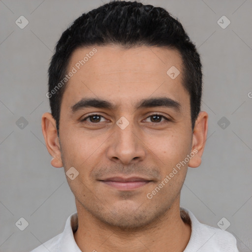 Joyful latino young-adult male with short  black hair and brown eyes