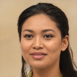 Joyful latino young-adult female with long  brown hair and brown eyes