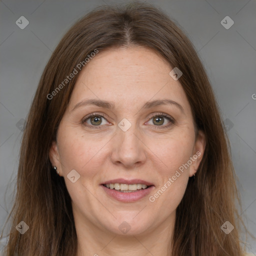 Joyful white adult female with long  brown hair and brown eyes