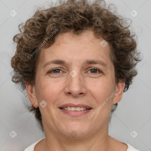 Joyful white adult female with short  brown hair and brown eyes