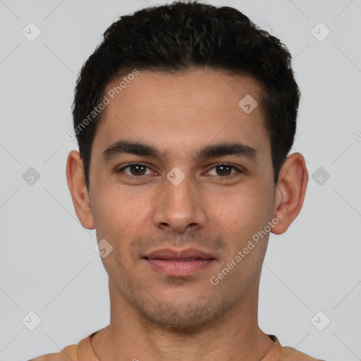 Joyful white young-adult male with short  black hair and brown eyes