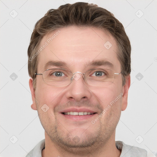 Joyful white adult male with short  brown hair and grey eyes