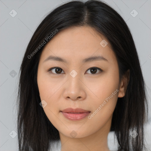 Joyful asian young-adult female with long  brown hair and brown eyes