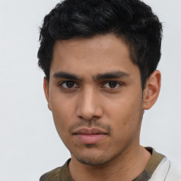 Neutral asian young-adult male with short  brown hair and brown eyes