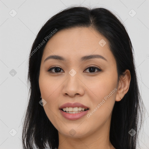 Joyful asian young-adult female with long  brown hair and brown eyes