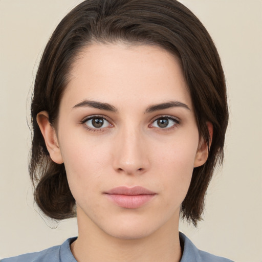 Neutral white young-adult female with medium  brown hair and brown eyes